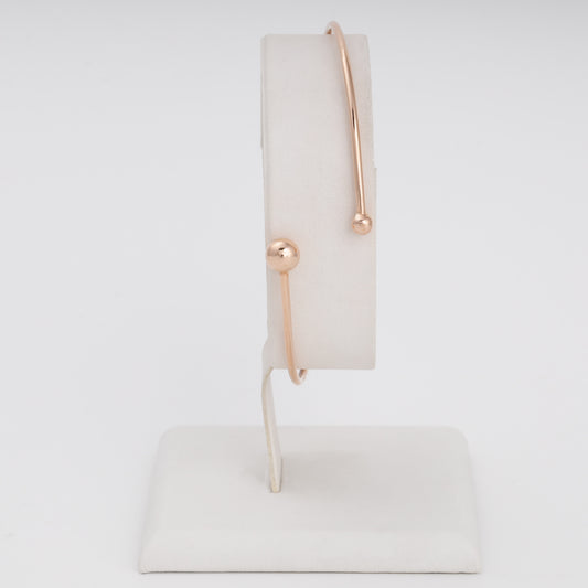 Minimalist 14k gold open bangle bracelet with ball ends on display stand, Ukrainian Jewelry, modern gold bracelet gift.