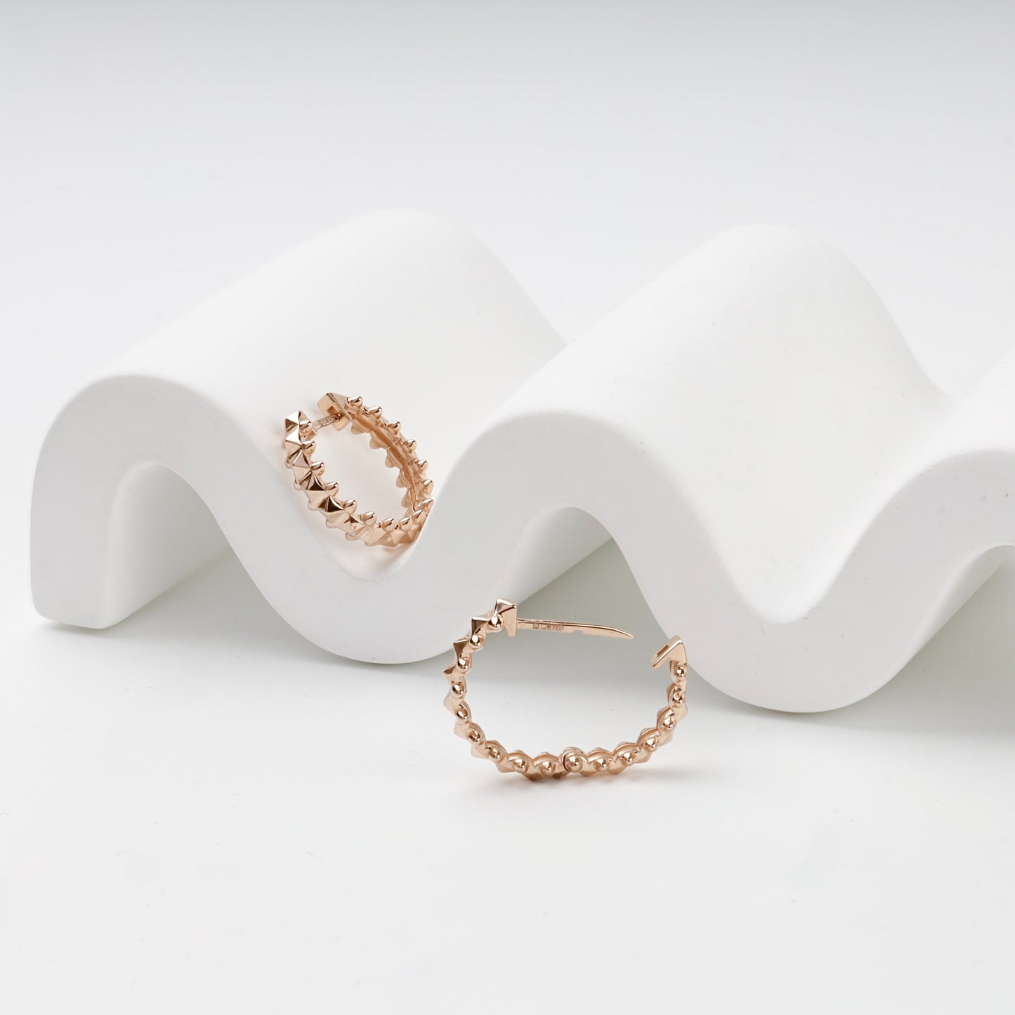 Geometric pyramid hoop earrings, open closure view