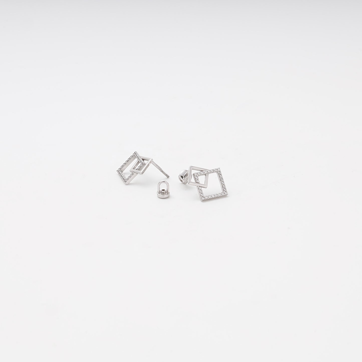 White gold 585 geometric stud earrings with CZ, side view showing push-back closure — Kabluchka