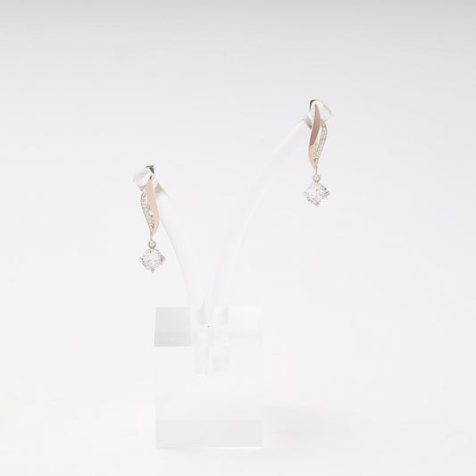 Silver 925 cubic zirconia twist drop earrings on a stand — Kabluchka