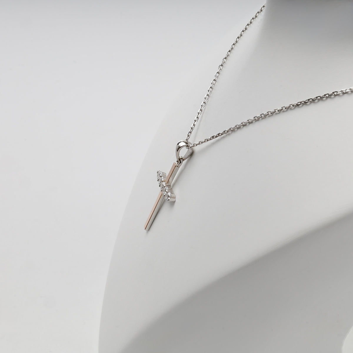Rhodium-plated Silver 925 and Gold 375 cubic zirconia cross pendant — display view — Kabluchka