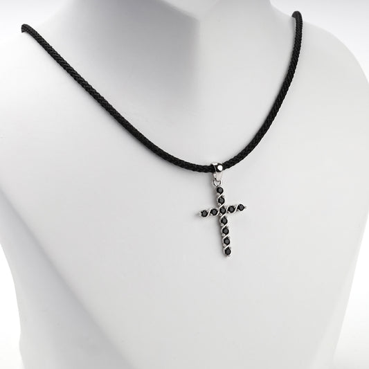 Rhodium-plated silver 925 twisted cross pendant with black cubic zirconia, angled view