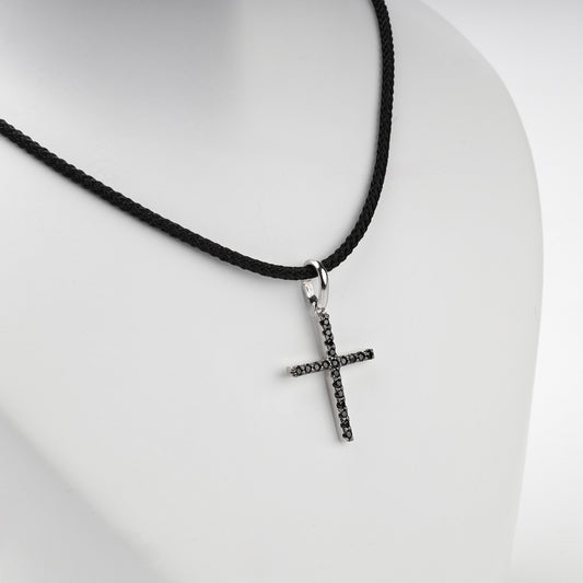 Silver 925 cross pendant with black cubic zirconia, angled view