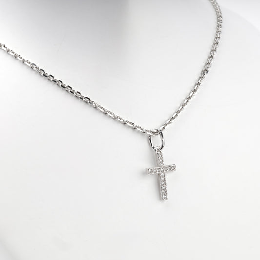 Silver 925 cross pendant with clear cubic zirconia, angled view