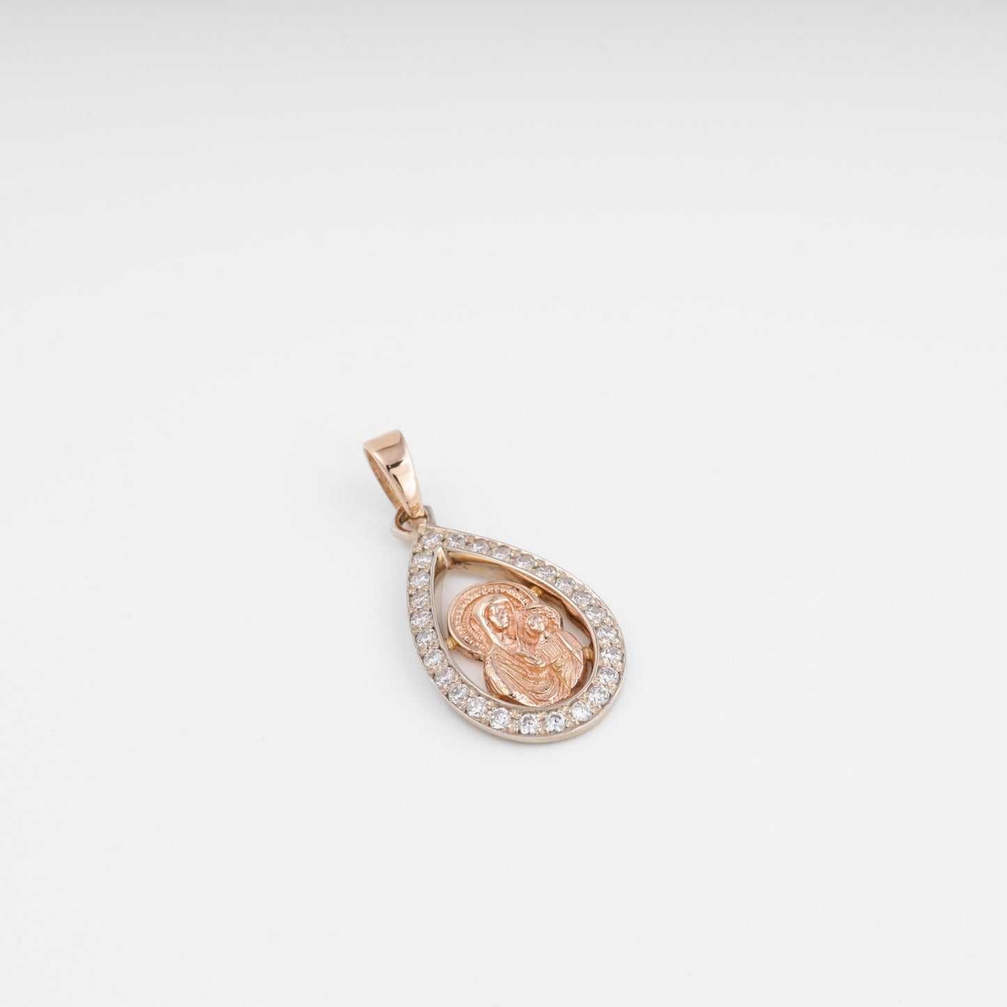 Rose gold Virgin Mary pendant angled detail view — Kabluchka