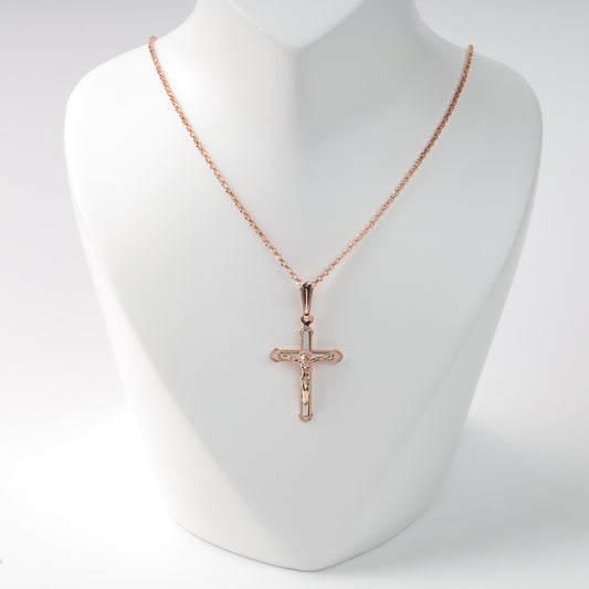 Sophisticated 14K (585) Rose Gold crucifix pendant on a matching delicate gold chain, beautifully displayed on a white jewelry bust.