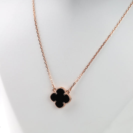 Rose gold 14K (585) necklace with a black onyx four-leaf clover pendant on a white mannequin.