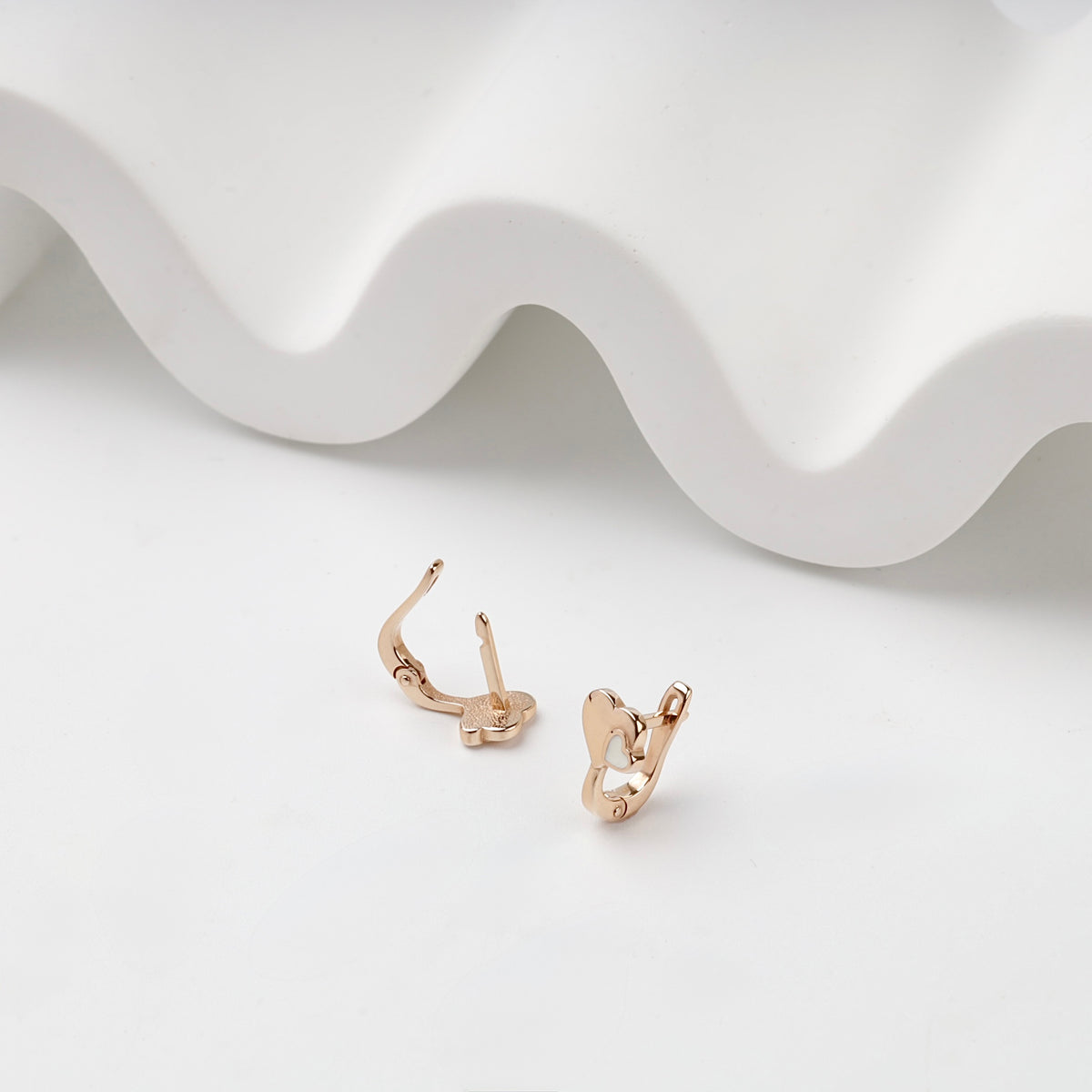 Rose Gold double heart kids earrings, open English-lock detail