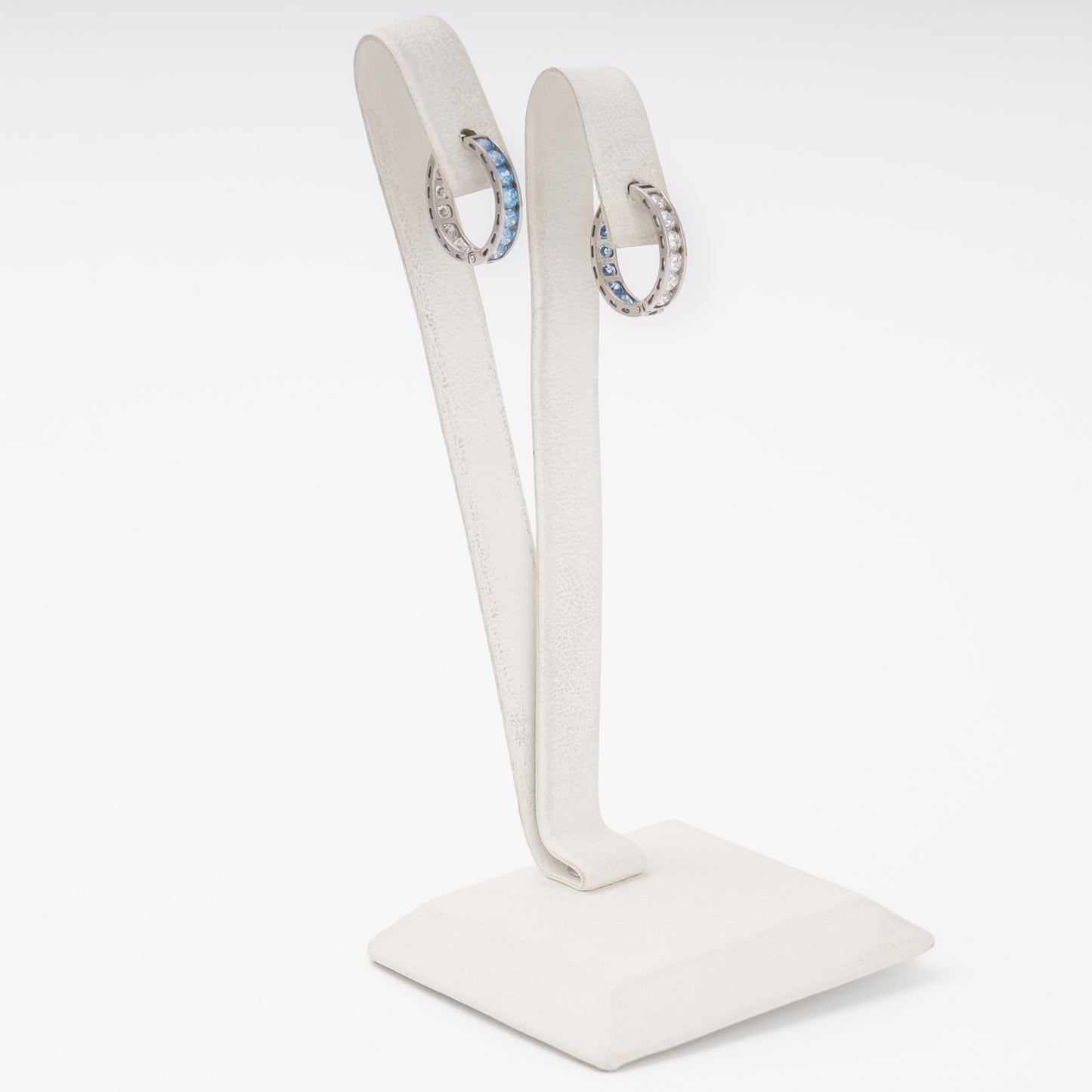 White gold huggie earrings side view, alternating blue and white stones — Kabluchka