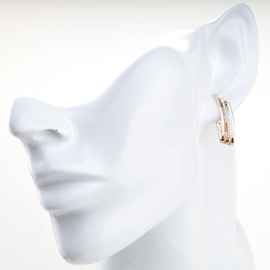 Rose gold triple-band earrings with clear cubic zirconia, side view