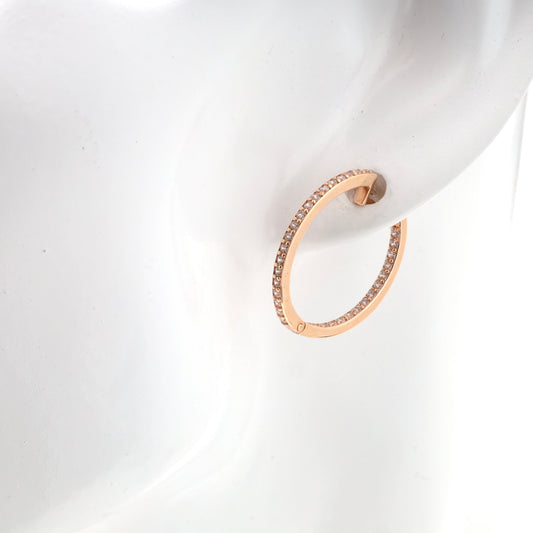 Gold hoop earrings with cubic zirconia on ear | Kabluchka