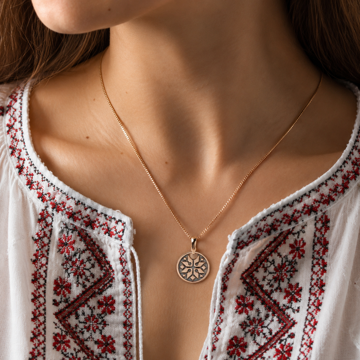 Ukrainian ornamental star pendant styled on a woman