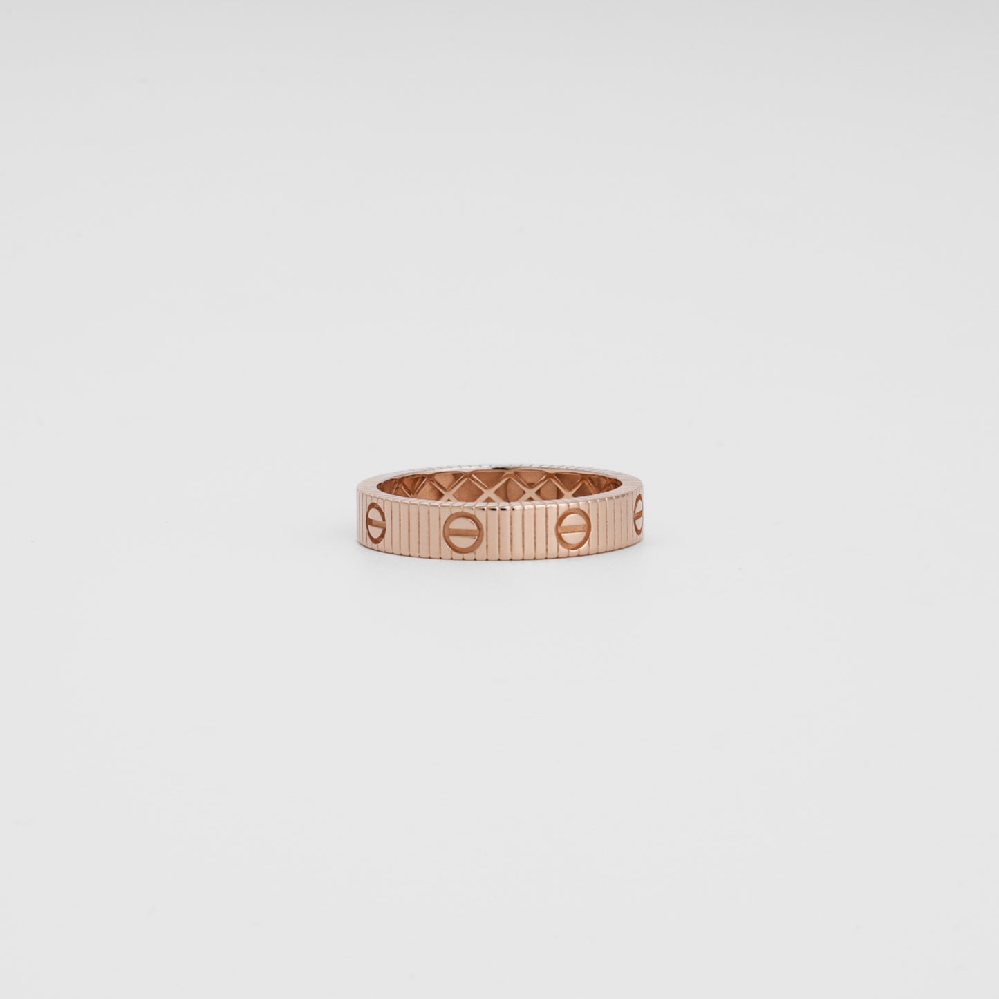 14k gold rose band ring with screw motif design on white background, Ukrainian Jewelry, minimalist gold ring, stacking wedding band.