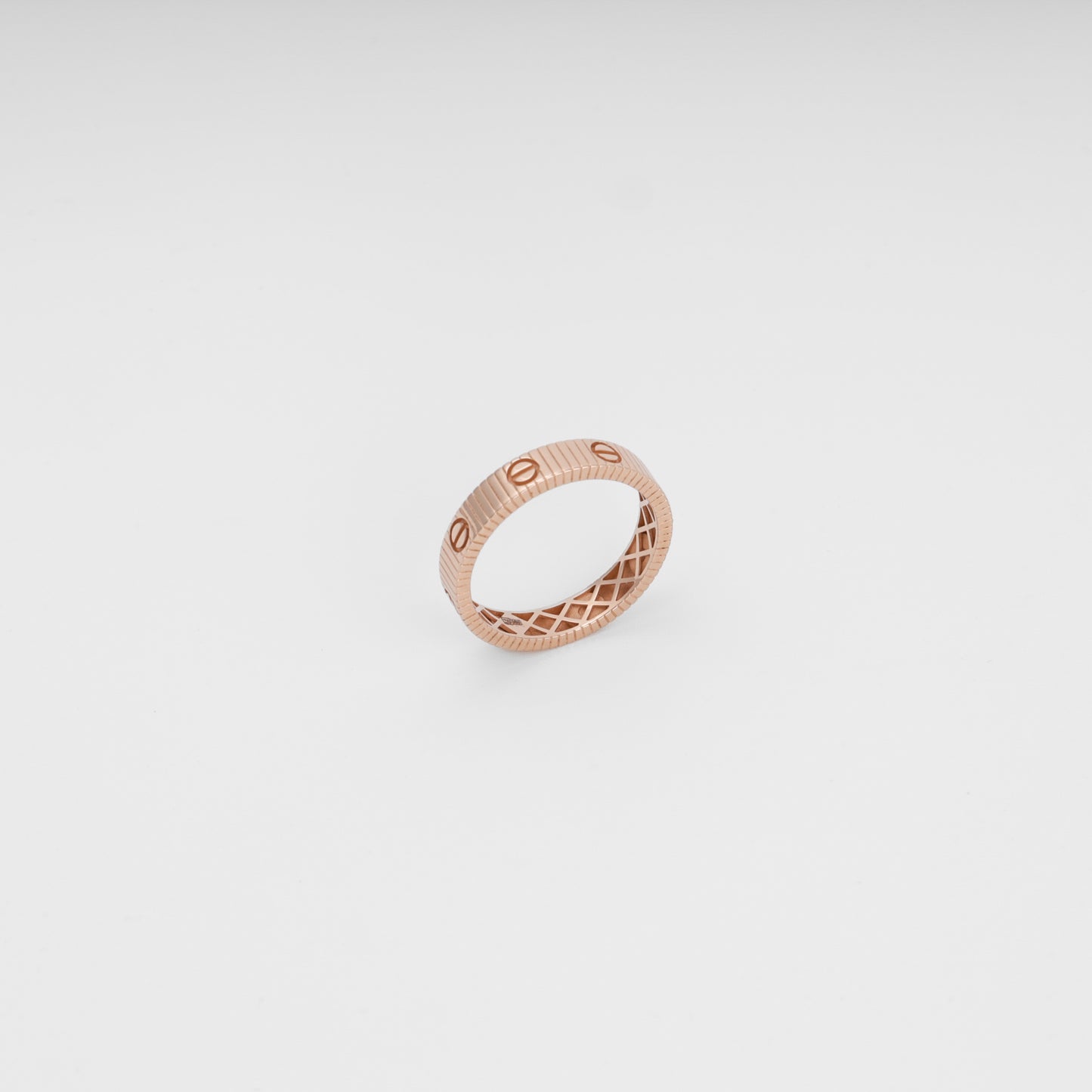 Rose gold 14k gold ring with engraved screw motif on white background, minimalist band Ukrainian Jewelry, wedding ring gift.