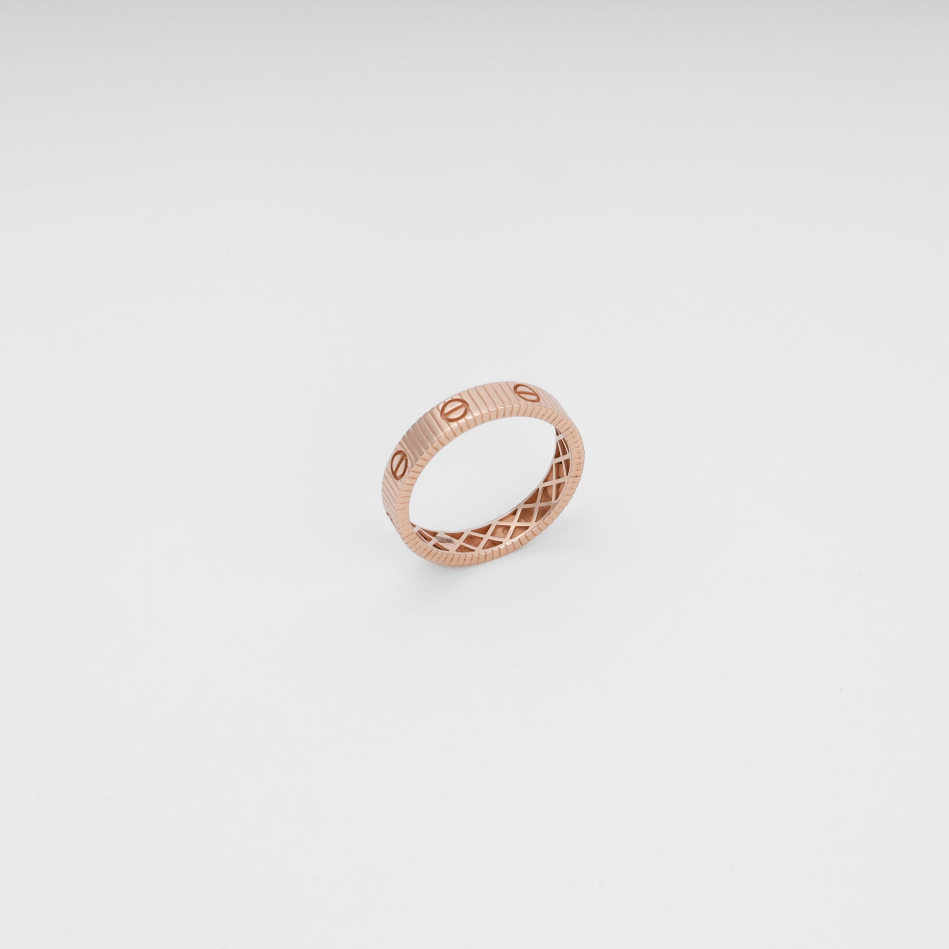 Rose gold 14k gold ring with engraved screw motif on white background, minimalist band Ukrainian Jewelry, wedding ring gift.