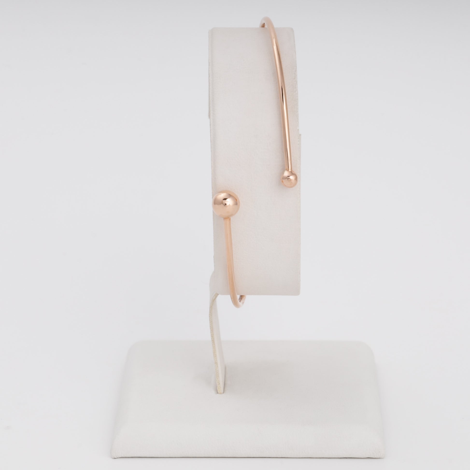 Minimalist 14k gold open bangle bracelet with ball ends on display stand, Ukrainian Jewelry, modern gold bracelet gift.