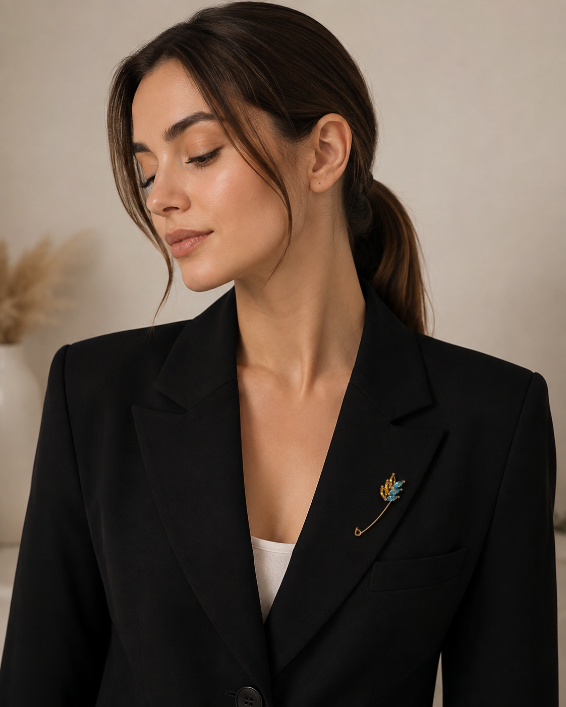 Blue and yellow wheat safety pin brooch styled on a lapel