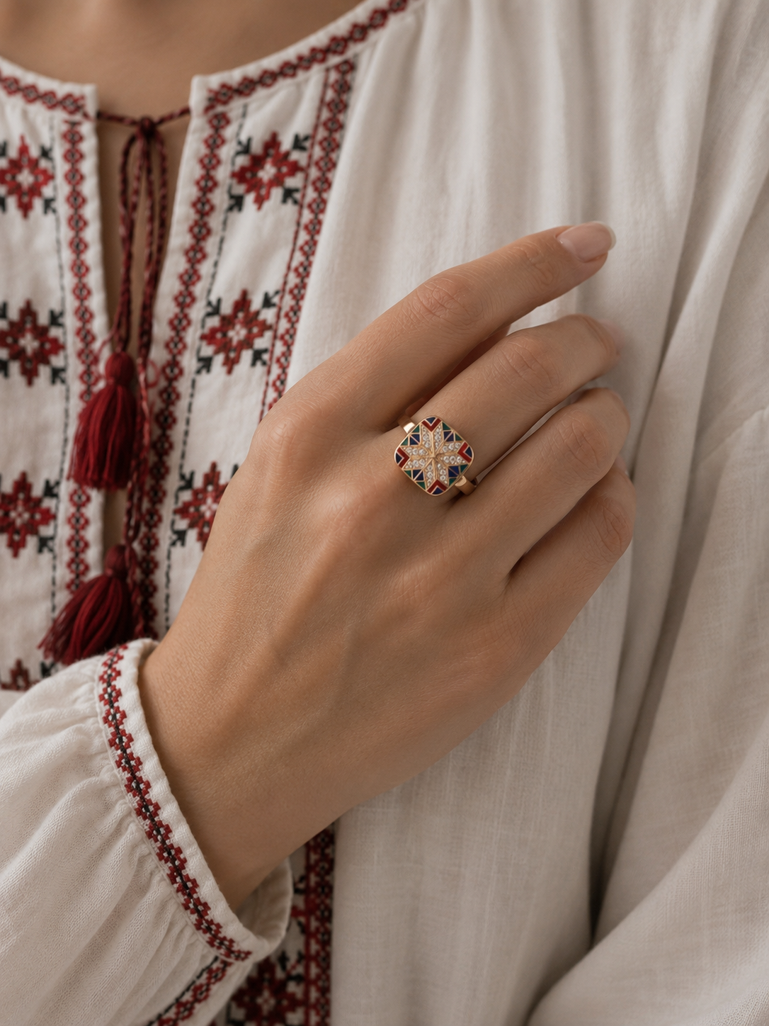 Multicolor enamel Ukrainian ornament ring styled on a hand