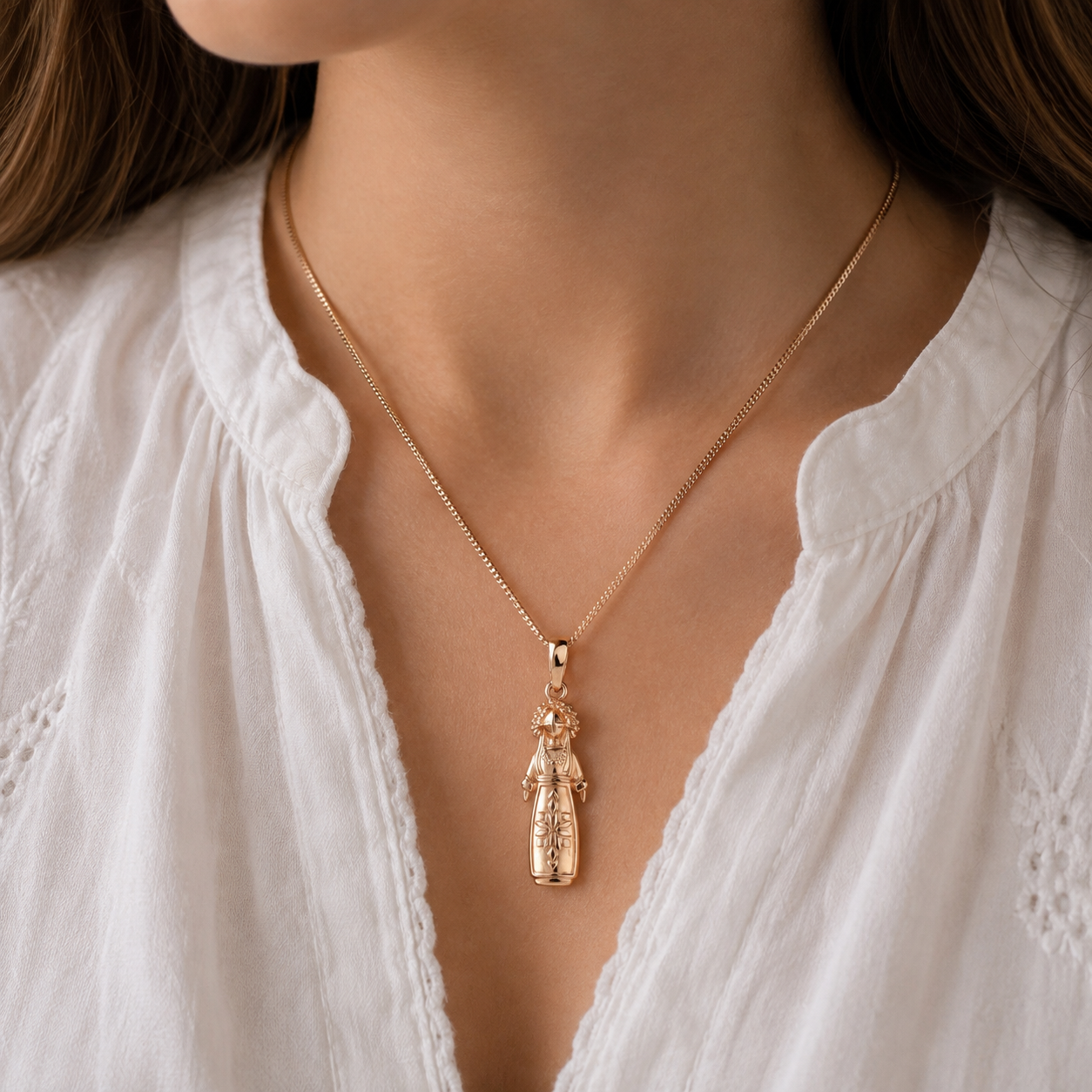 Motanka doll pendant styled on a woman