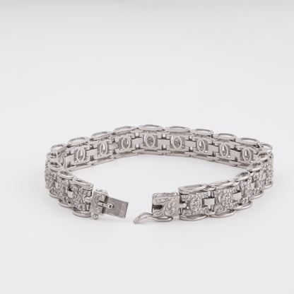 Pavé link bracelet showing flexible geometric links in white gold