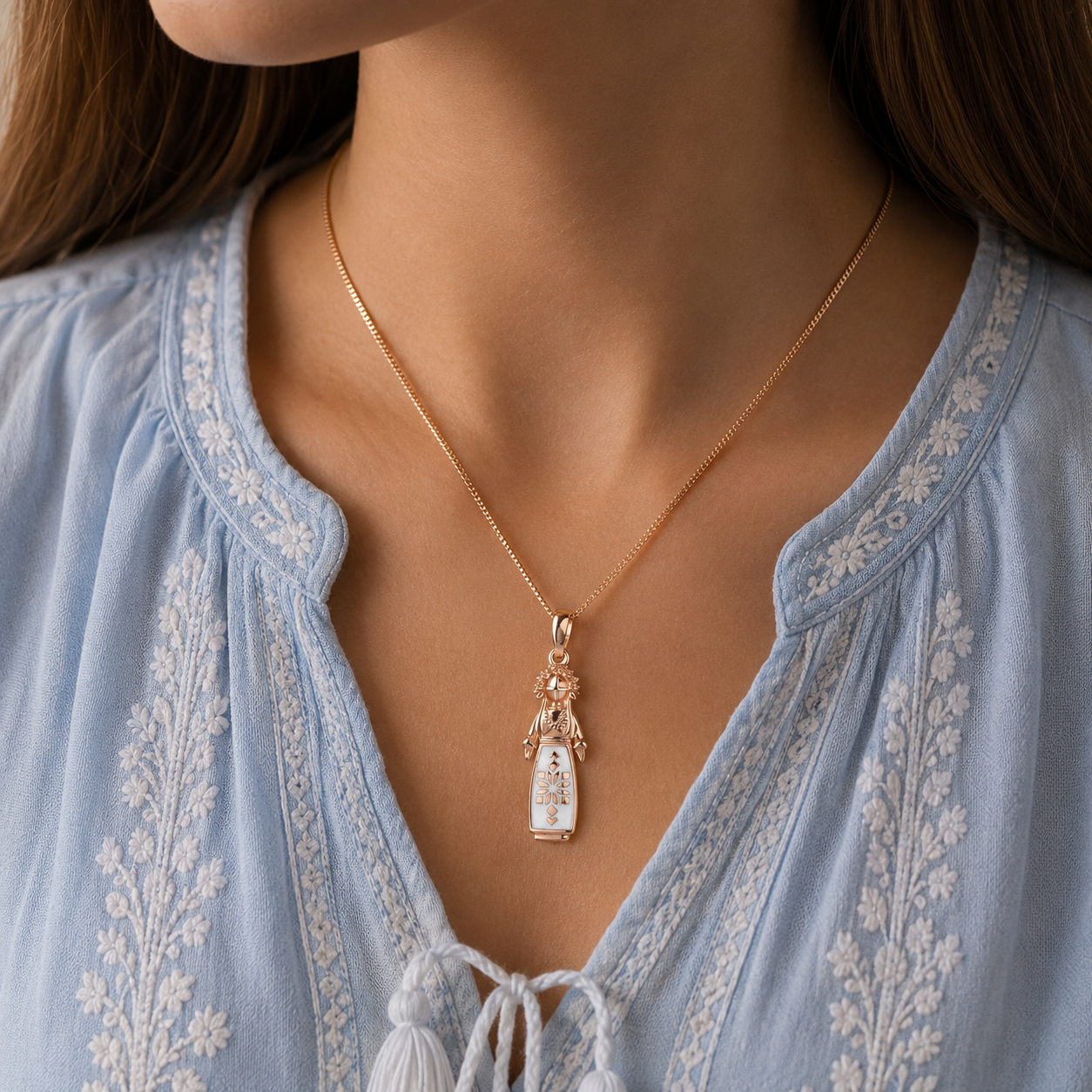 White enamel motanka doll pendant styled on a woman