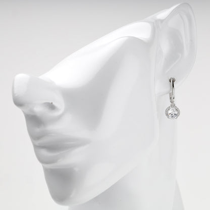 White Gold halo drop earring shown on ear
