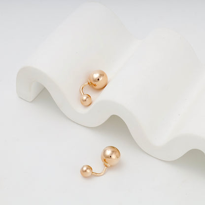 Rose gold double ball stud earrings angled view — Kabluchka
