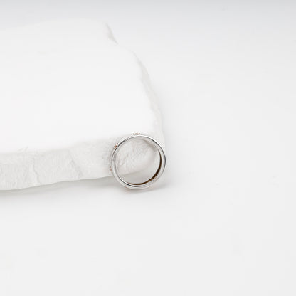Polished two-tone gold band ring showing inner profile
