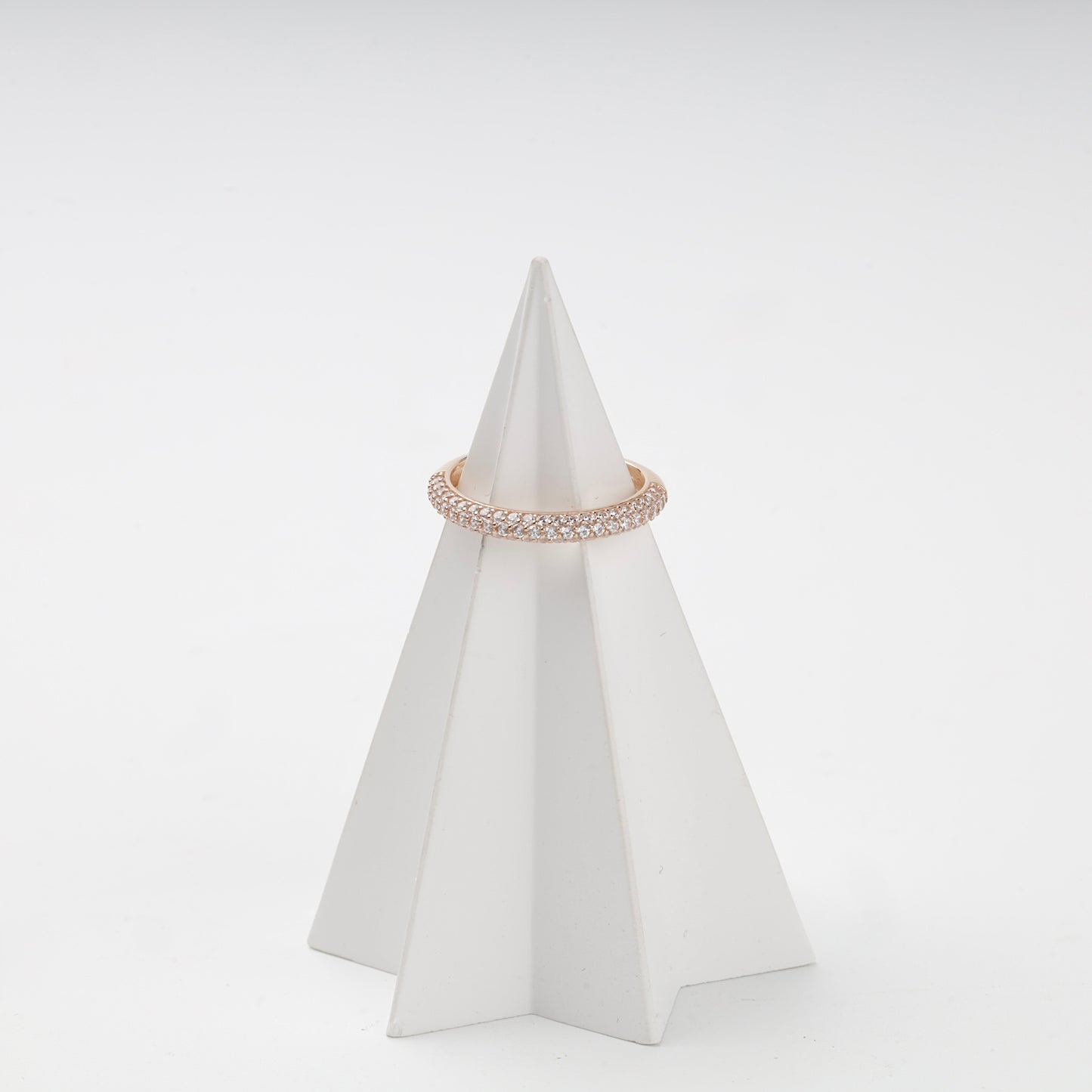 Double-row cubic zirconia ring on display stand