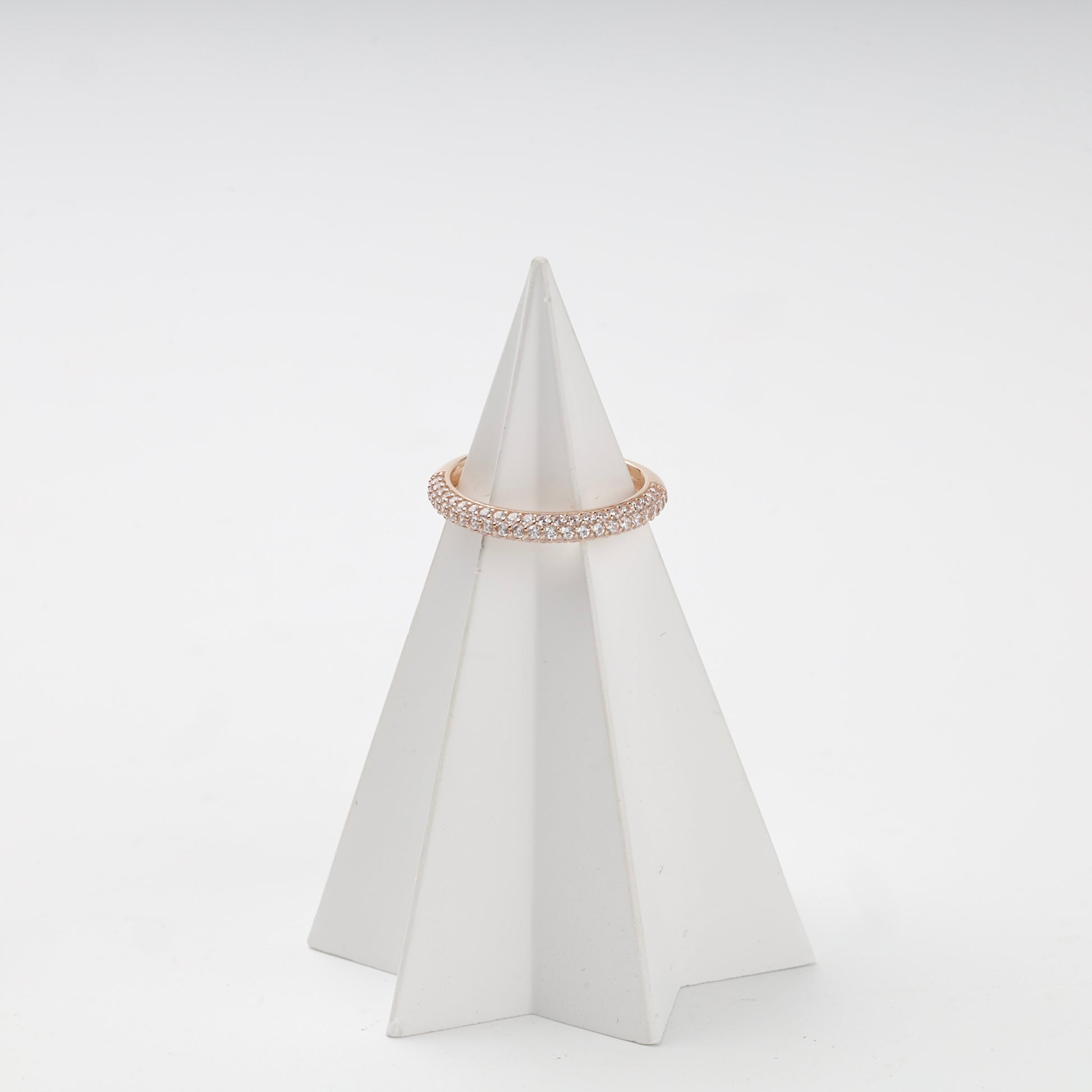 Double-row cubic zirconia ring on display stand