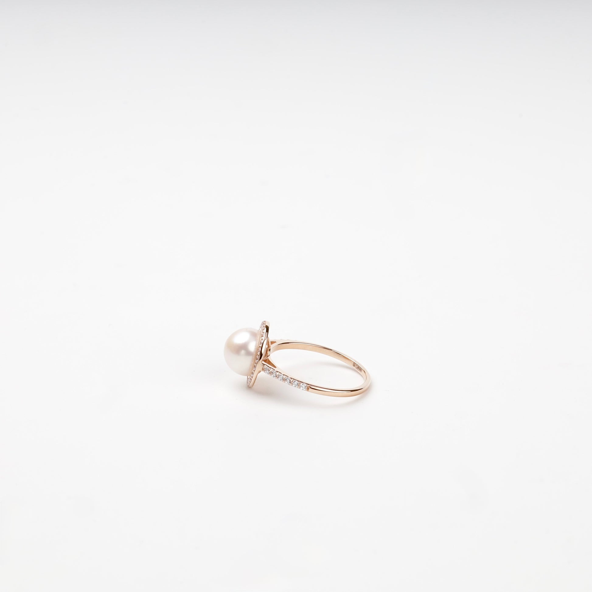 Rose gold pearl and cubic zirconia ring on display — Kabluchka