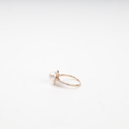 Rose gold pearl and cubic zirconia ring on display — Kabluchka