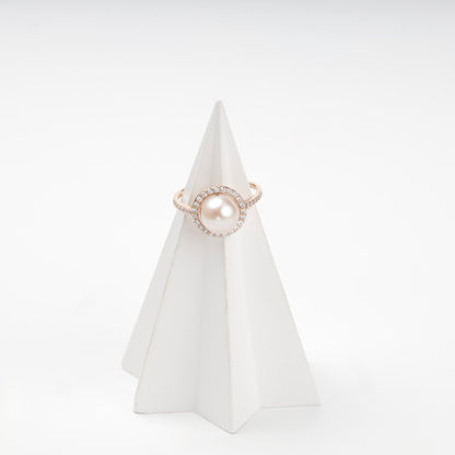 Pearl halo ring with stone-set shoulders, angled view — Kabluchka