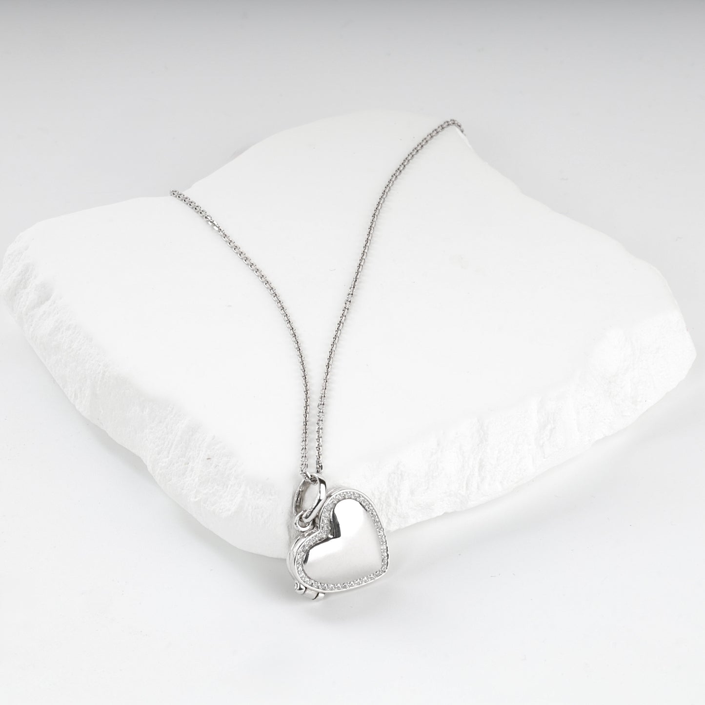 Clear cubic zirconia border on a Silver 925 heart locket