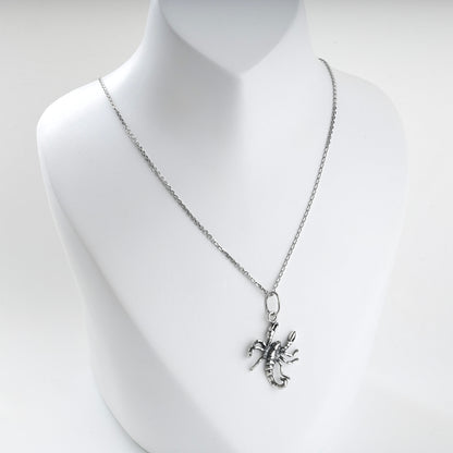 Silver scorpion pendant claws, legs and curved tail detail