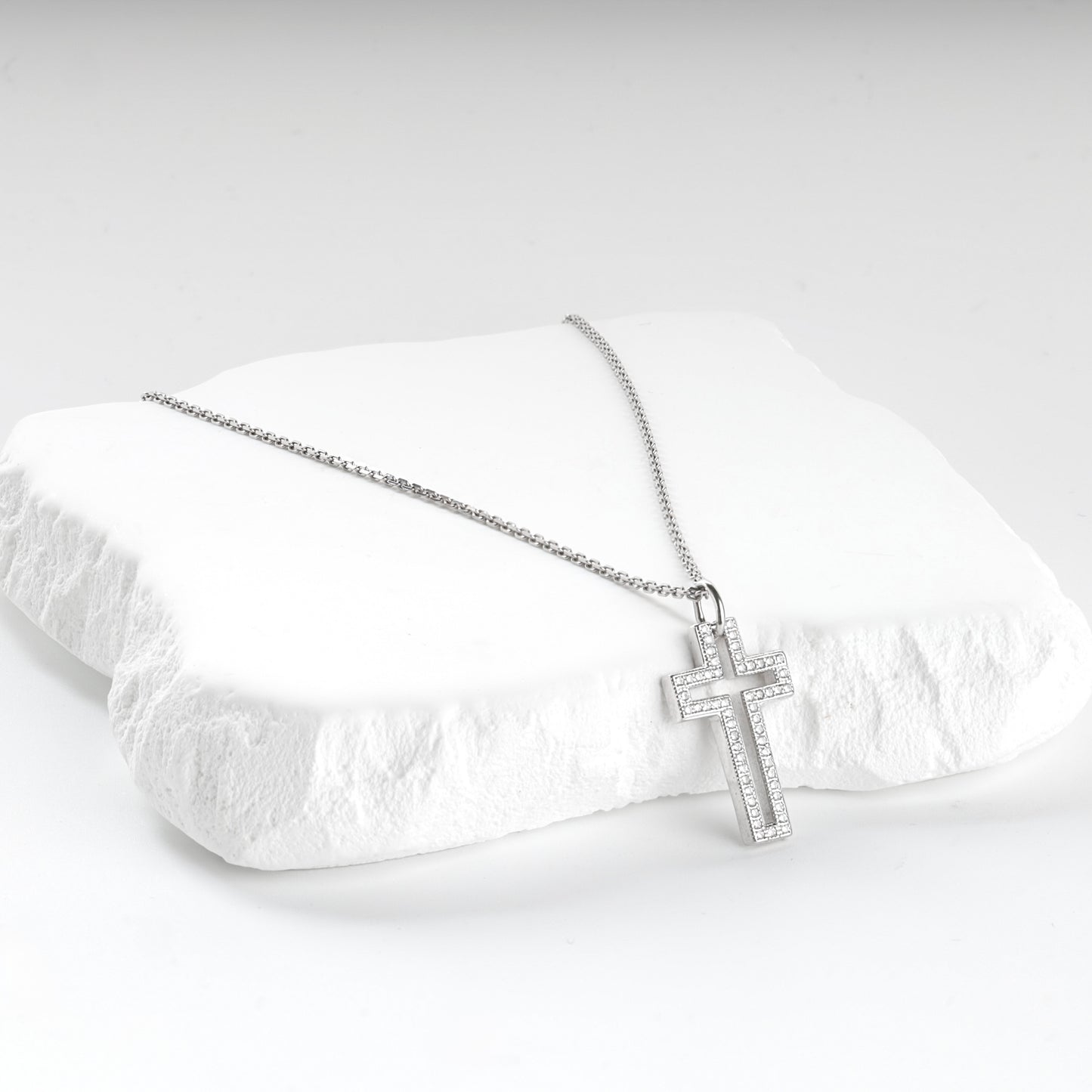 Rhodium-plated Silver 925 cubic zirconia open cross pendant, styled view — Kabluchka
