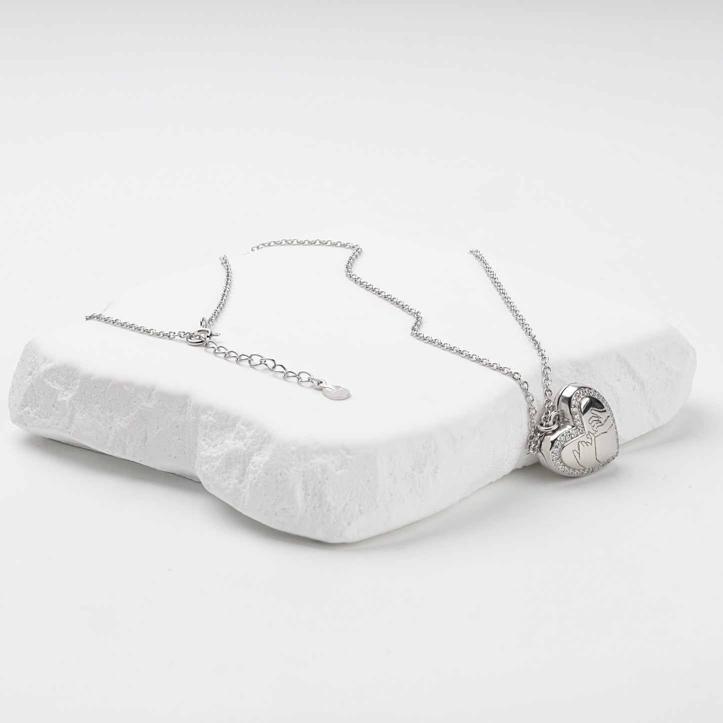 Heart locket necklace with extension chain and spring-ring clasp