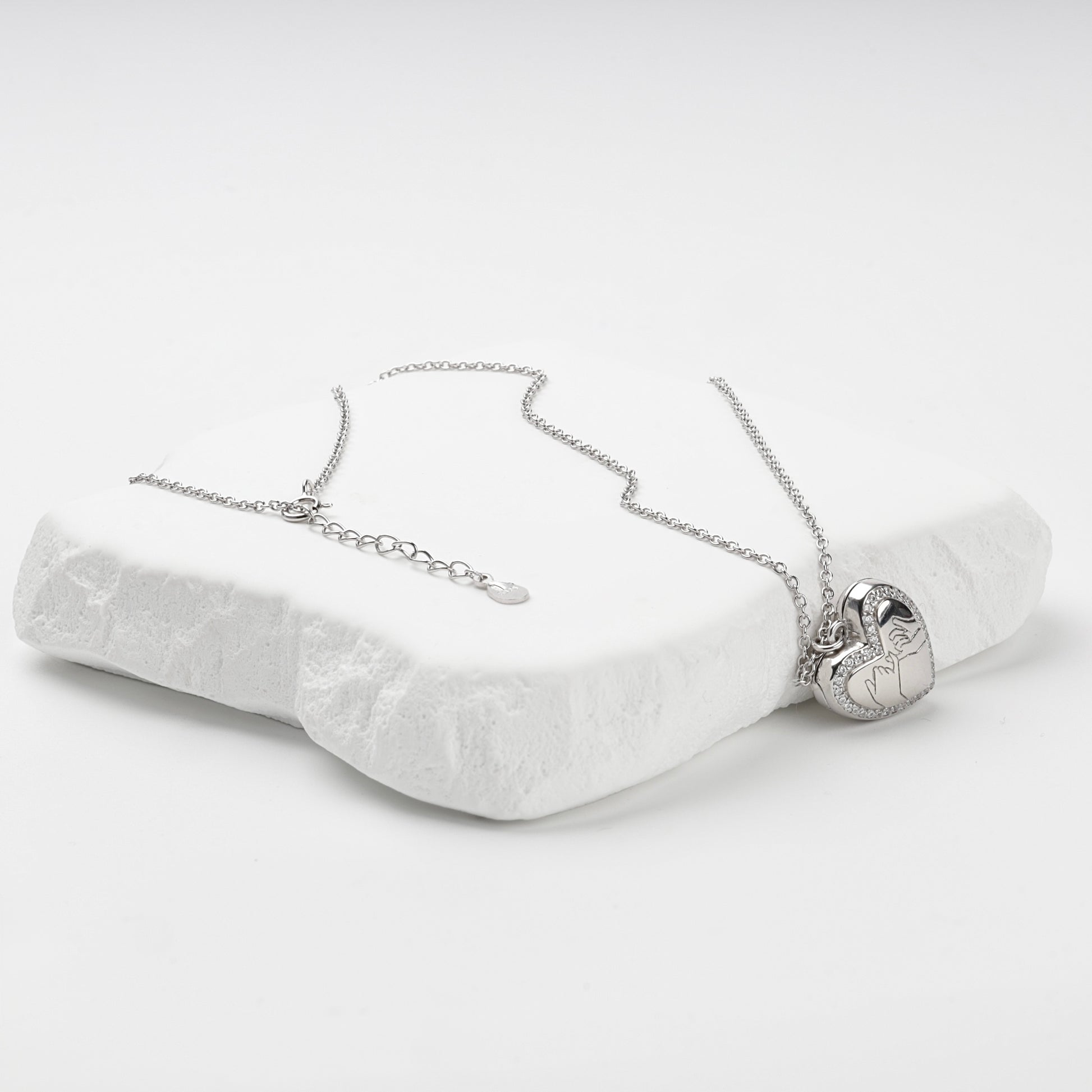 Heart locket necklace with extension chain and spring-ring clasp