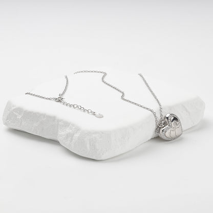 Heart locket necklace with extension chain and spring-ring clasp