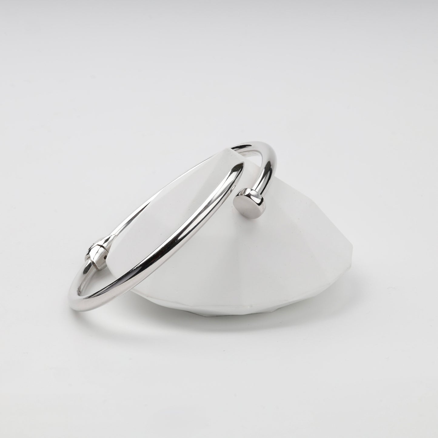 Polished nail-shaped Silver 925 bangle on display