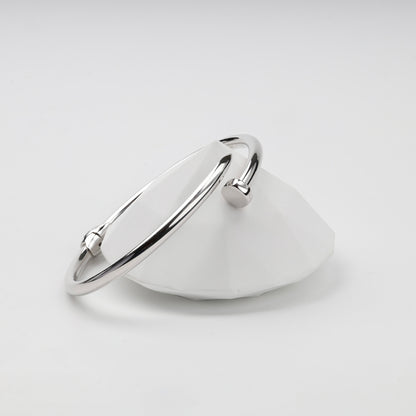Polished nail-shaped Silver 925 bangle on display