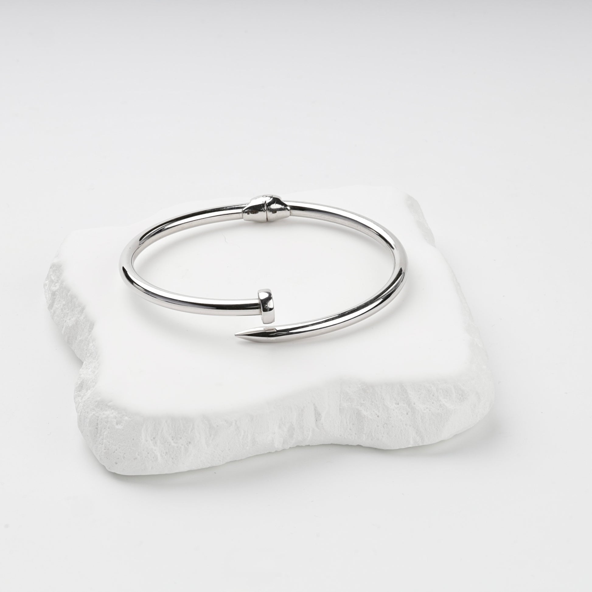 Rhodium-plated Silver 925 nail bangle on stone display