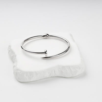 Rhodium-plated Silver 925 nail bangle on stone display