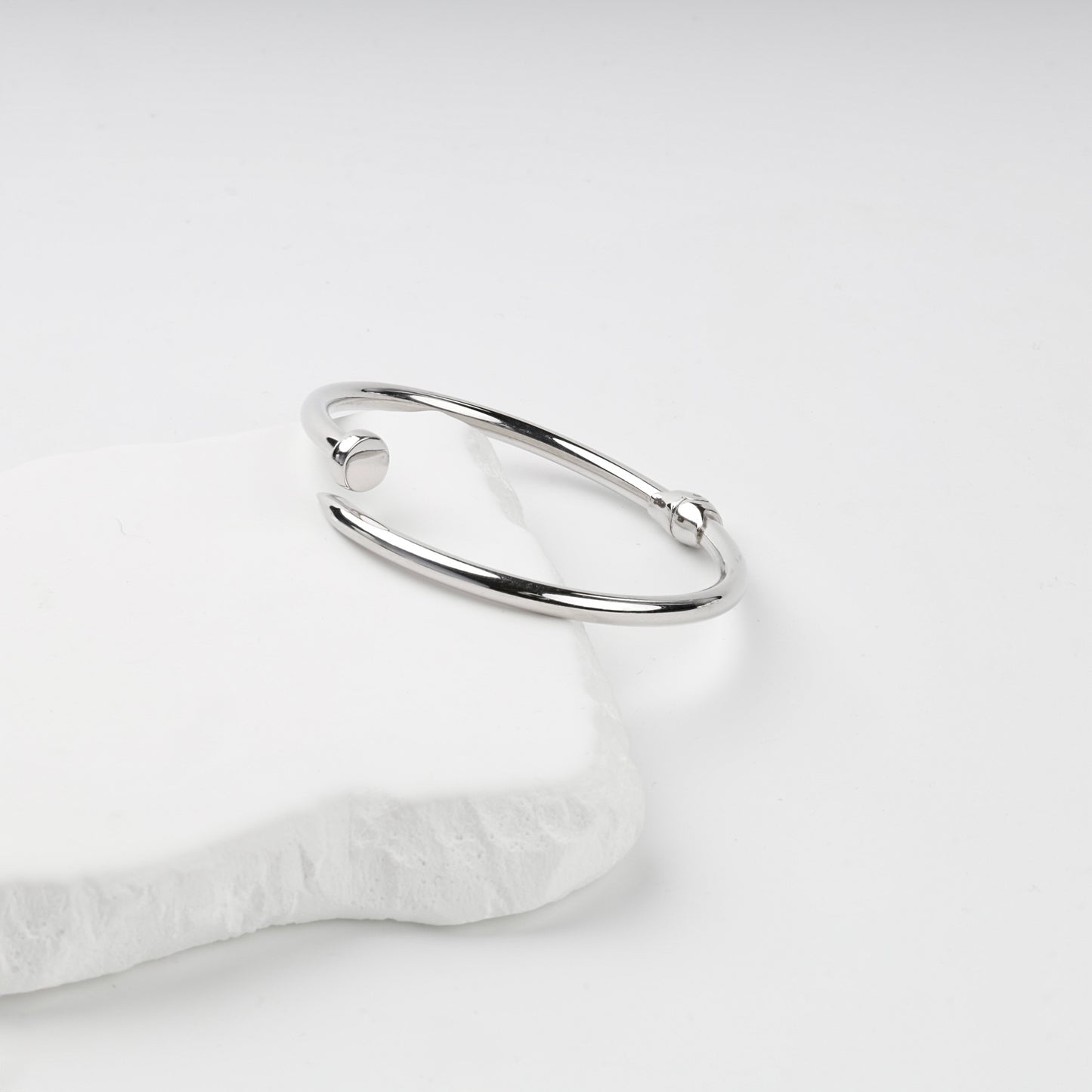 Side view of polished nail bangle bracelet