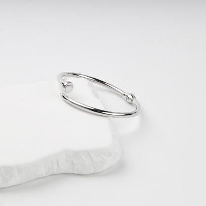 Side view of polished nail bangle bracelet