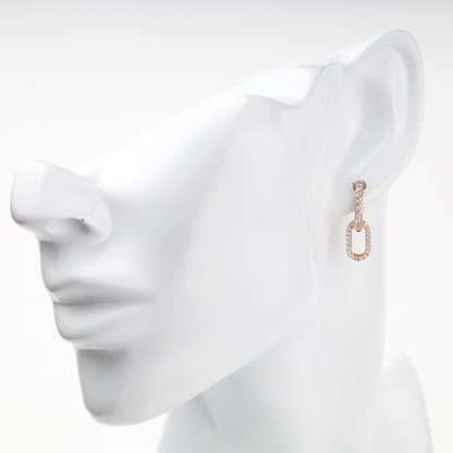 Rose Gold cubic zirconia elongated huggie earring — on-ear view — Kabluchka
