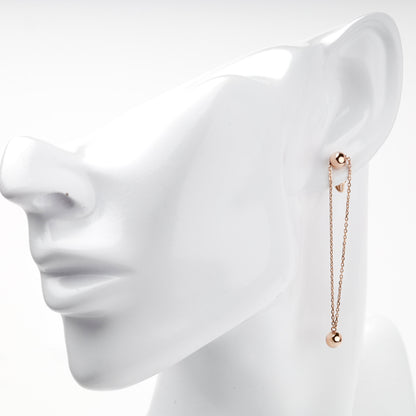 Rose gold double-chain ball drop earring on ear — Kabluchka