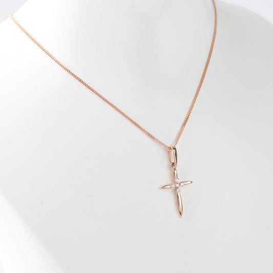 14K rose gold cross pendant with CZ stones on white background — Kabluchka