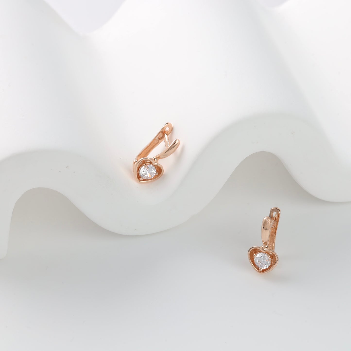 Rose gold heart drop earrings close-up - Kabluchka Jewelry