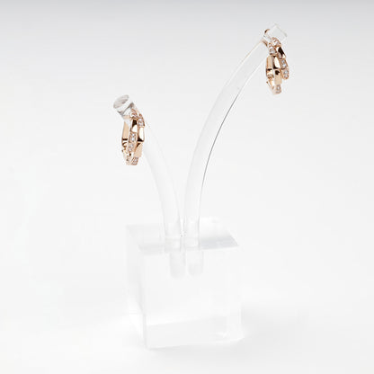 Rose gold interlaced hoop earrings on display — Kabluchka